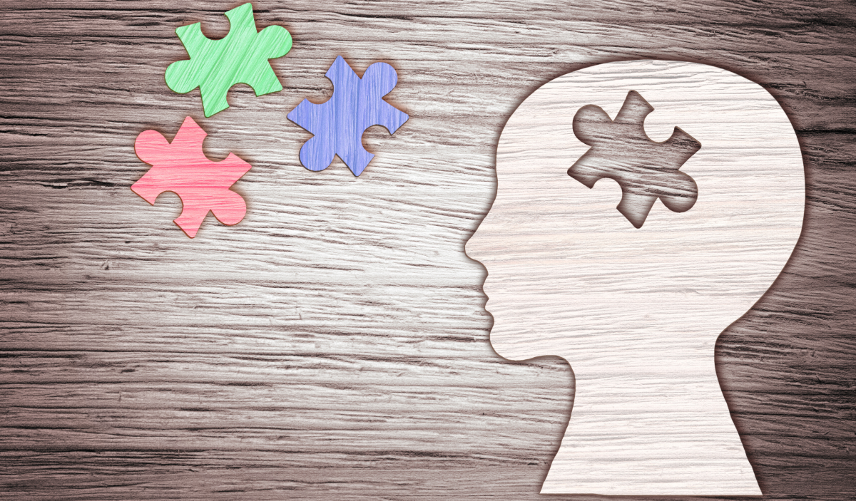 Illustration représentant la maladie d'Alzheimer avec une silhouette et des pièces de puzzle symbolisant les troubles de la mémoire.